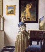 A Young Woman Standing at a Virginal JanVermeer